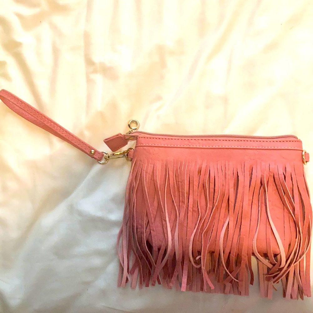 Pink hand bag that is about 8 inches
